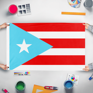 A mockup of the custom flag 'prank PR flag' held up on a table during print checking