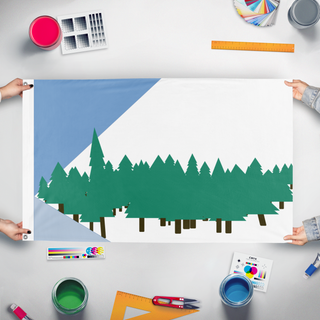A mockup of the custom flag '44 spruce flag' held up on a table during print checking
