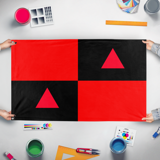 A mockup of the custom flag 'jamedawe flag' held up on a table during print checking