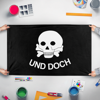 A mockup of the custom flag 'a flag' held up on a table during print checking