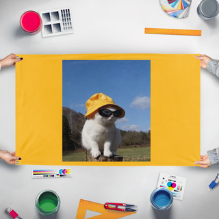A mockup of the custom flag 'minimeow flag' held up on a table during print checking