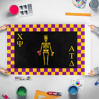 A mockup of the custom flag 'ATD Chi Psi flag' held up on a table during print checking