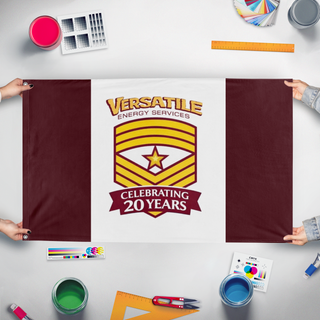 A mockup of the custom flag 'VESLPS flag' held up on a table during print checking