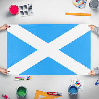 A mockup of the custom flag 'Scottish flag' held up on a table during print checking