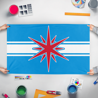 A mockup of the custom flag 'AnA flag' held up on a table during print checking