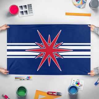 A mockup of the custom flag 'ANN flag' held up on a table during print checking