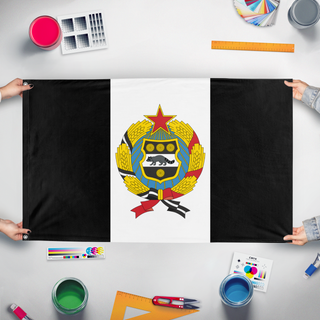 A mockup of the custom flag 'Socialist Personal Arms flag' held up on a table during print checking