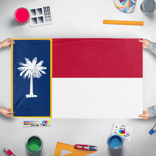 A mockup of the custom flag 'United State of Carolina flag' held up on a table during print checking