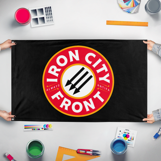 A mockup of the custom flag 'iron city flag' held up on a table during print checking
