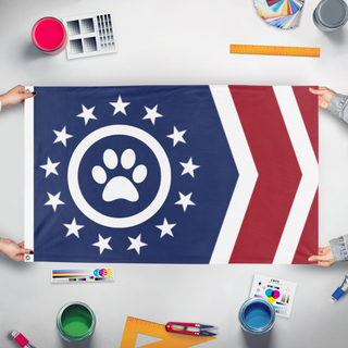 A mockup of the custom flag 'Feline Front flag' held up on a table during print checking