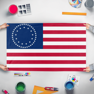 A mockup of the custom flag 'USA 50 Star Betty Ross Style   flag' held up on a table during print checking