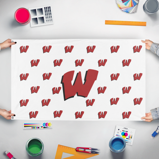 A mockup of the custom flag 'Warrior W's White/red flag' held up on a table during print checking