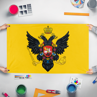 A mockup of the custom flag 'Russian Imperial Standard' held up on a table during print checking