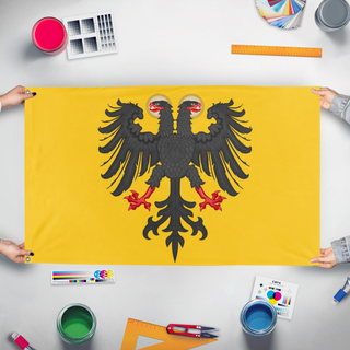 A mockup of the custom flag 'Holy Roman Empire Redesign  flag' held up on a table during print checking