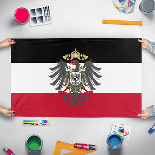 A mockup of the custom flag 'German Empire Redesign flag' held up on a table during print checking