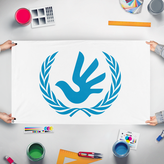 A mockup of the custom flag 'Flag of Humanity' held up on a table during print checking