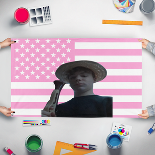A mockup of the custom flag 'Linus der Geile Olda flag' held up on a table during print checking