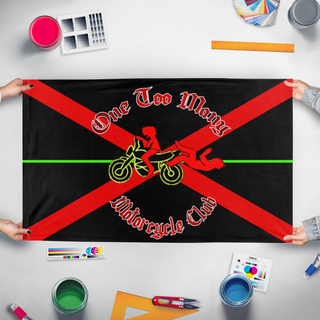 A mockup of the custom flag 'OTMMC flag' held up on a table during print checking