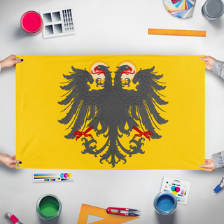A mockup of the custom flag 'Holy Roman Empire Redesign flag' held up on a table during print checking