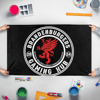A mockup of the custom flag 'bkg flag' held up on a table during print checking