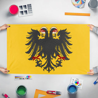 A mockup of the custom flag 'Holy Roman Empire Remastered flag' held up on a table during print checking