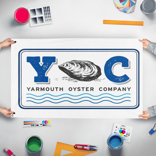 A mockup of the custom flag 'YOC flag' held up on a table during print checking