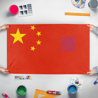 A mockup of the custom flag 'test flag' held up on a table during print checking