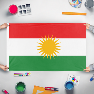 A mockup of the custom flag 'kur flag' held up on a table during print checking