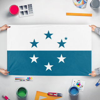 A mockup of the custom flag 'Osea flag' held up on a table during print checking