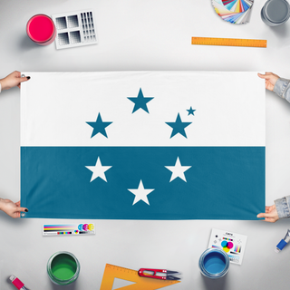 A mockup of the custom flag 'Osea flag' held up on a table during print checking