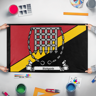 A mockup of the custom flag 'Blackguards flag' held up on a table during print checking