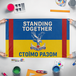 A mockup of the custom flag 'shaktar flag' held up on a table during print checking