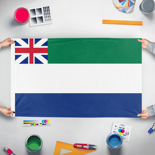 A mockup of the custom flag 'Protectorate of New Caledonia flag' held up on a table during print checking
