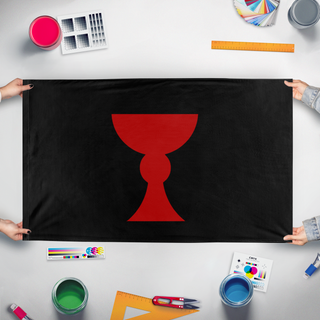 A mockup of the custom flag 'Hussite flag' held up on a table during print checking