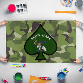 A mockup of the custom flag 'Black Spade flag' held up on a table during print checking