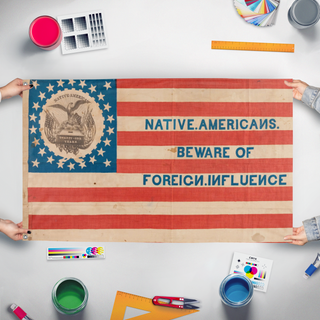 A mockup of the custom flag 'know-nothing flag' held up on a table during print checking