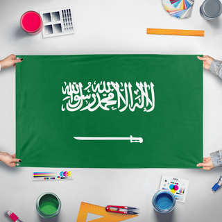 A mockup of the custom flag 'Saudi Arabia  flag' held up on a table during print checking