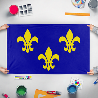 A mockup of the custom flag 'Kingdom Of France  flag' held up on a table during print checking