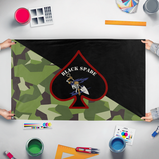 A mockup of the custom flag 'Black Spade flag' held up on a table during print checking