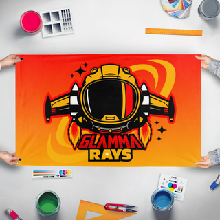 A mockup of the custom flag 'Glamma Rays flag' held up on a table during print checking
