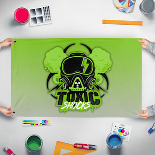 A mockup of the custom flag 'shocks flag' held up on a table during print checking