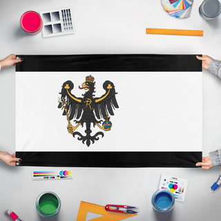A mockup of the custom flag 'Prussia Redesign  flag' held up on a table during print checking