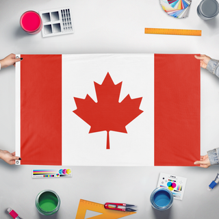 A mockup of the custom flag 'Canadian Hand Waving flag' held up on a table during print checking