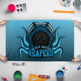 A mockup of the custom flag 'reapers flag' held up on a table during print checking