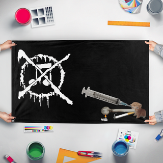 A mockup of the custom flag 'grindcore flag' held up on a table during print checking