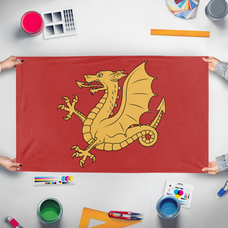 A mockup of the custom flag 'Kingdom Of Wessex Redesigned flag' held up on a table during print checking