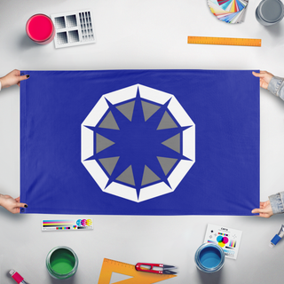 A mockup of the custom flag 'pen flag' held up on a table during print checking