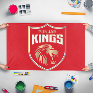 A mockup of the custom flag 'pbks flag' held up on a table during print checking