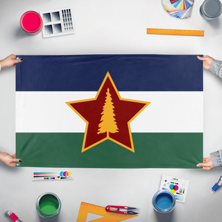 A mockup of the custom flag 'Socialist Cascadia flag' held up on a table during print checking