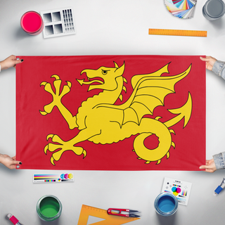 A mockup of the custom flag 'Kingdom Of Wessex flag' held up on a table during print checking